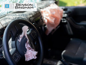 Interior of a car showing deployed airbags, indicative of a case for a Las Vegas car accident attorney