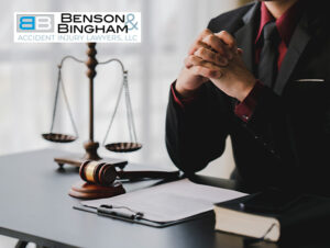 Las Vegas car accident attorney with gavel and scales of justice, symbolizing legal expertise.