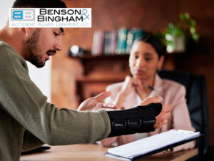 Client discussing a Worker's Compensation Claim with a lawyer at Benson Bingham office.