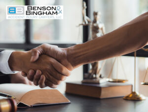 Lawyer and client handshake at Benson Bingham, concluding a Nevada Injury Claim discussion