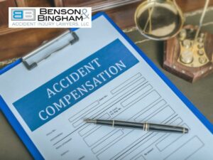 Accident compensation form with a pen, presented by Benson Bingham Injury Lawyers