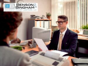 Lawyer discussing settlement details with a client in an office