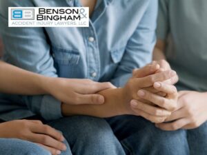 Close-up of people offering emotional support by holding hands